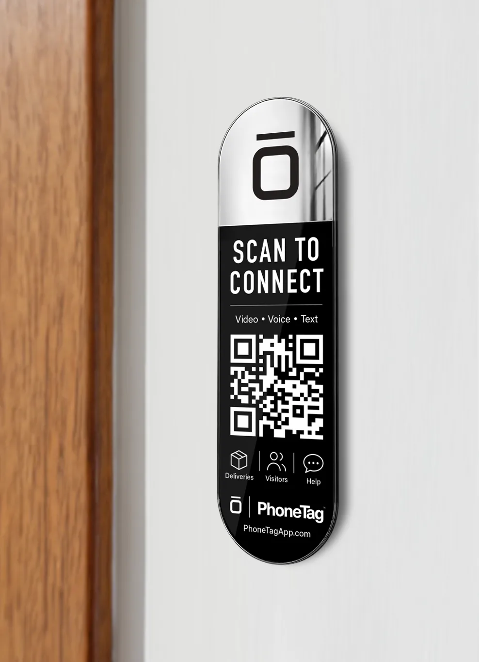 The PhoneTag Intercom mounted on the wall beside a front door